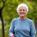 Mature person practicing yoga outdoors