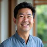 Portrait of Michael Chen, a certified meditation teacher.