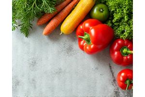 A colorful assortment of fresh, healthy vegetables on a kitchen counter